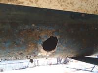 A hull breach in a boat's hull, before the seal is fitted